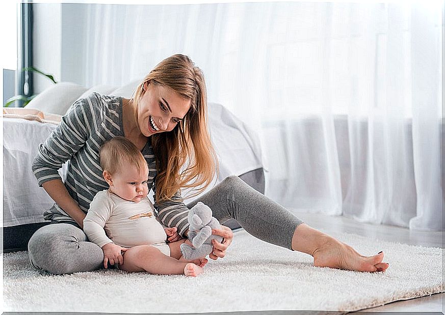 mom sitting with baby