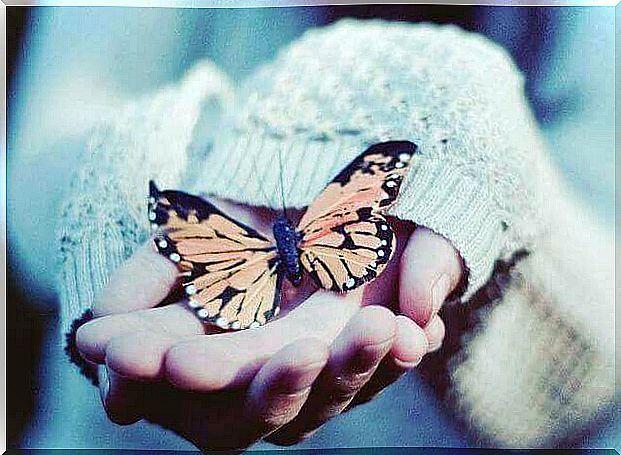 woman-with-butterfly-in-hands