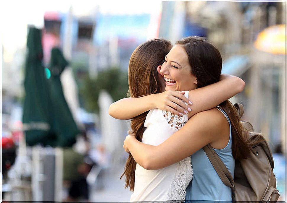 Friends giving each other a hug