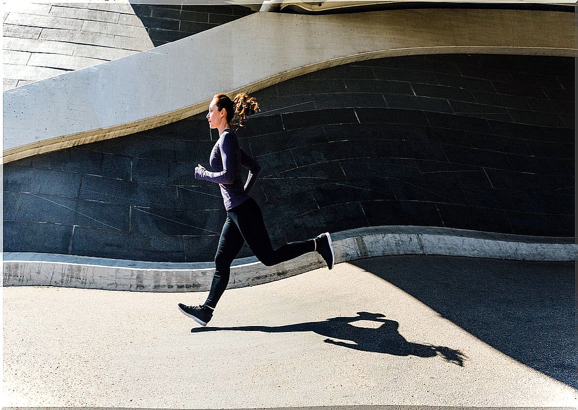 Woman jogs in the city.