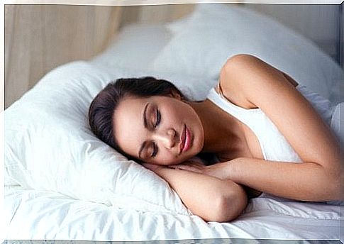 Woman resting on a bed