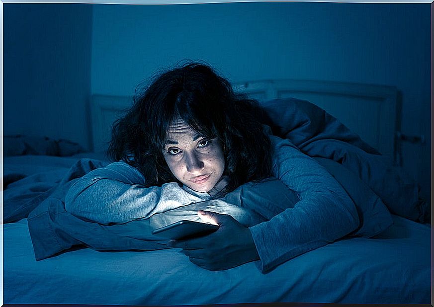 Girl with insomnia with mobile.